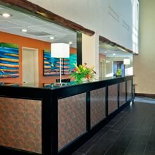 Double Tree Hotel: Reception desk, woodwork, paint, cooper panels, and tile